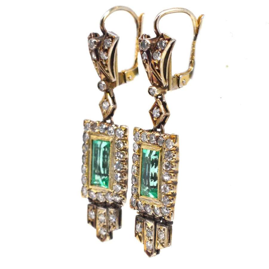 Art Deco 18ct gold drop earrings with emeralds and diamonds, showcasing vintage 1920s geometric design.