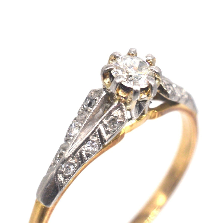 Art Deco 18ct gold and platinum diamond solitaire ring with diamond shoulders, ideal for engagement.