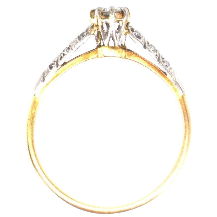 Art Deco 18ct gold and platinum diamond solitaire ring with diamond shoulders, showcasing elegant design.