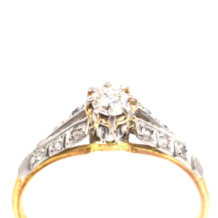 Art Deco 18ct gold and platinum diamond solitaire ring with diamond shoulders, perfect for engagements.
