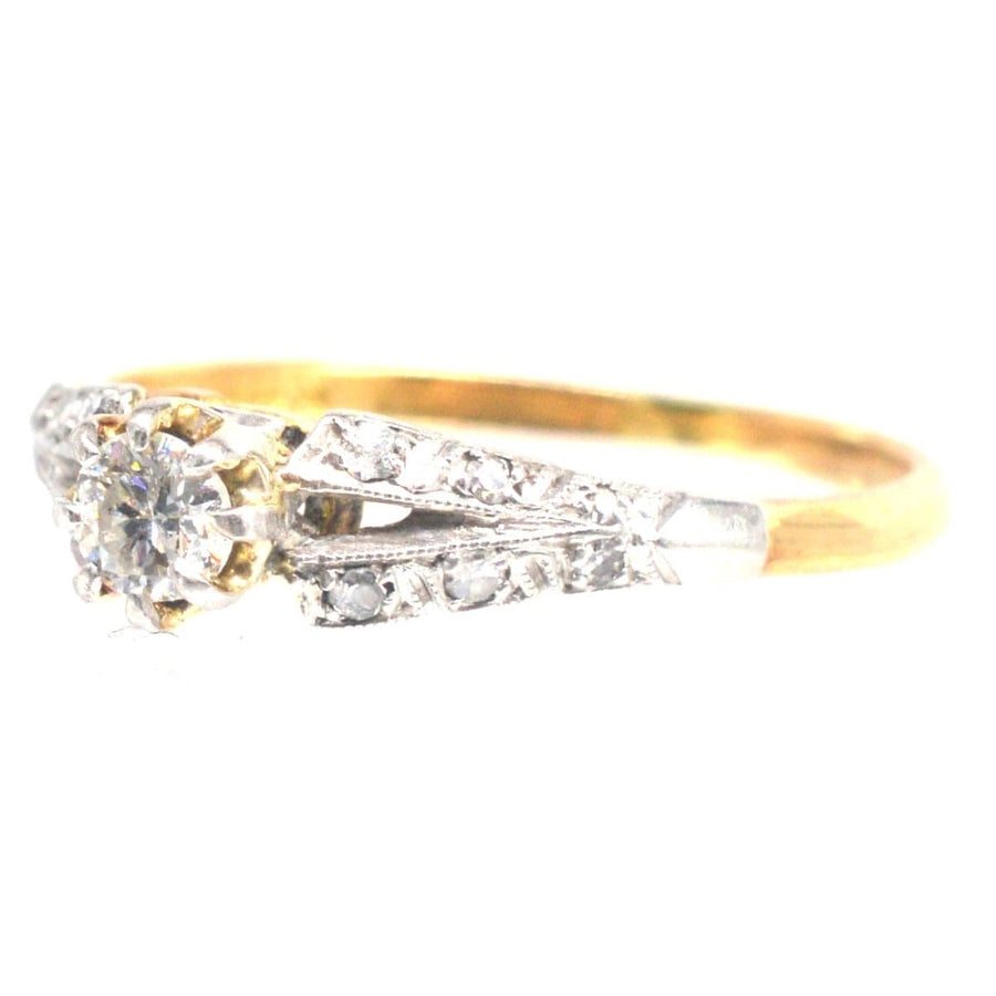 Art Deco 18ct gold and platinum diamond solitaire ring with diamond shoulders, perfect for engagement.