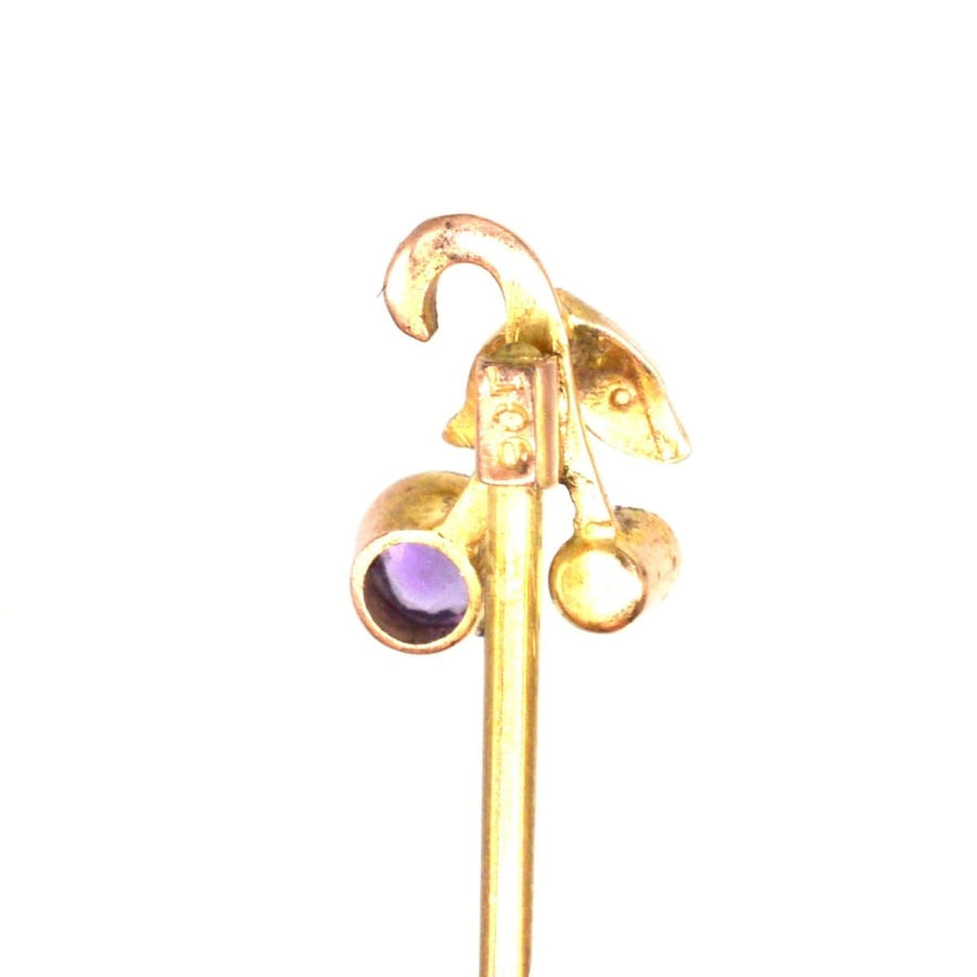 Art Deco 9ct gold tie pin featuring floral design with amethyst and pearl, a perfect vintage accessory from the 1920s.