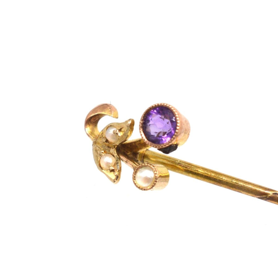 Art Deco 9ct gold tie pin featuring amethyst and pearl in floral design, vintage piece from 1920s.