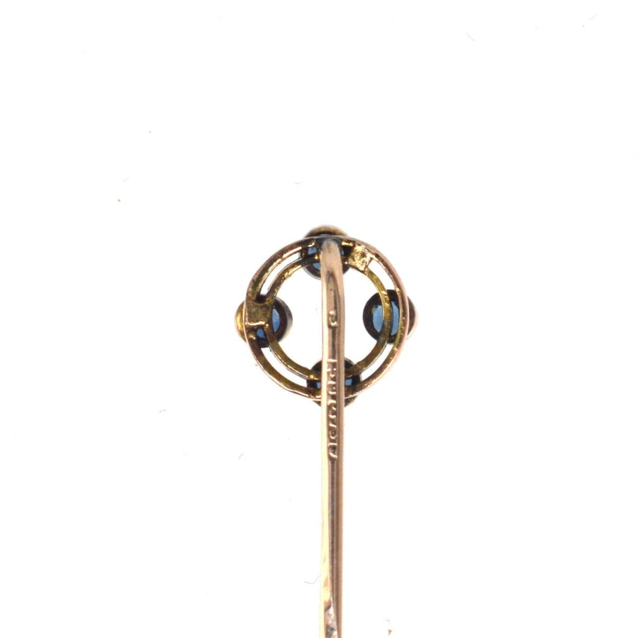 Art Deco 9ct gold circular tie pin featuring four sapphires, hallmarked Chester 1924, perfect for silk ties.