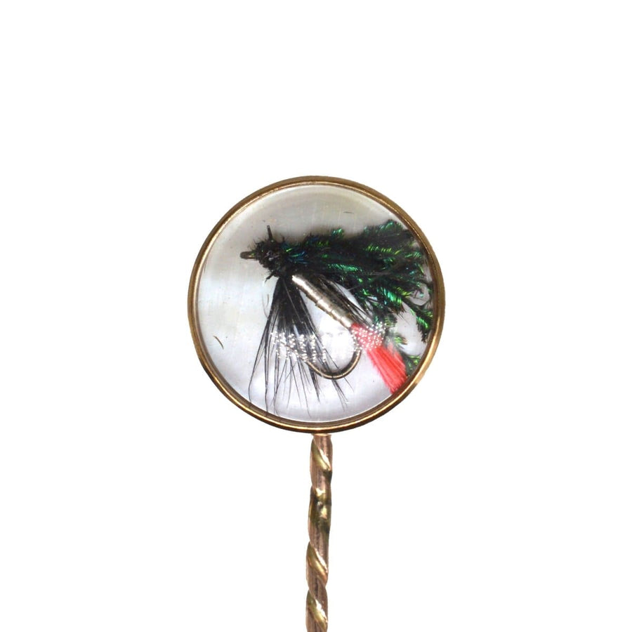 Art Deco 9ct Gold fishing lure tie pin featuring intricate details and Essex Crystal against mother of pearl.
