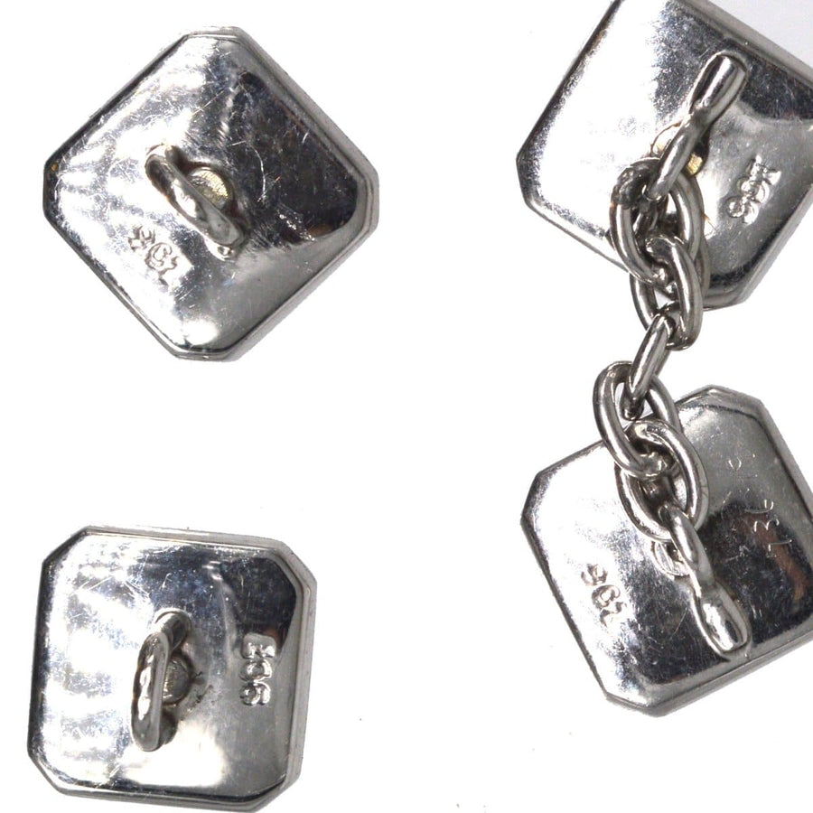 Art Deco 9ct white gold cufflinks set with onyx and diamonds, featuring a stylish hexagonal design.