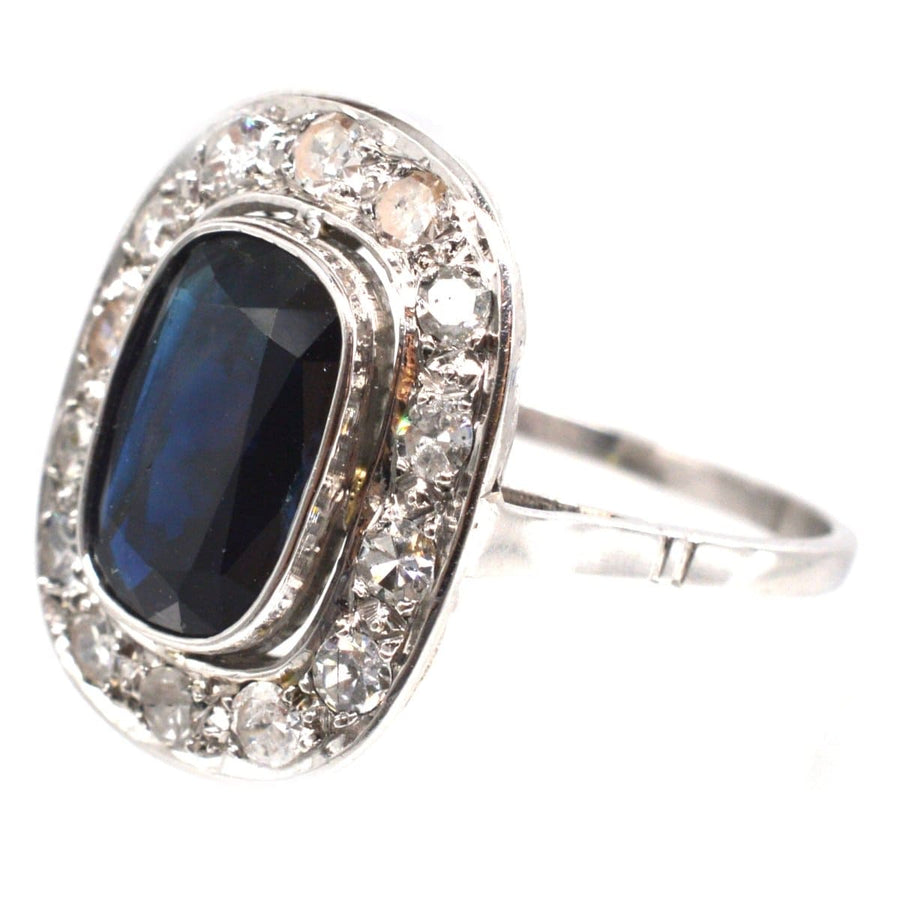 Art Deco French platinum ring with dark sapphire and diamond cluster, elegant engagement ring.