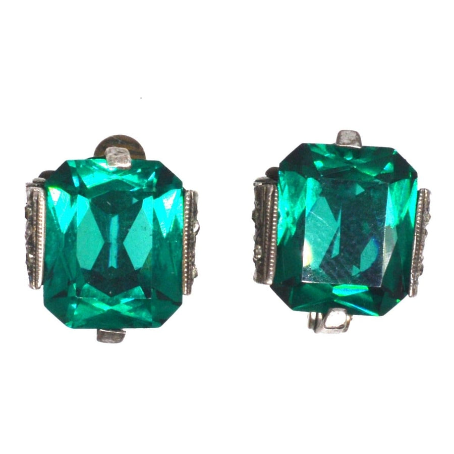 Art Deco interchangeable earrings featuring vibrant green paste stones in an elegant silver setting.