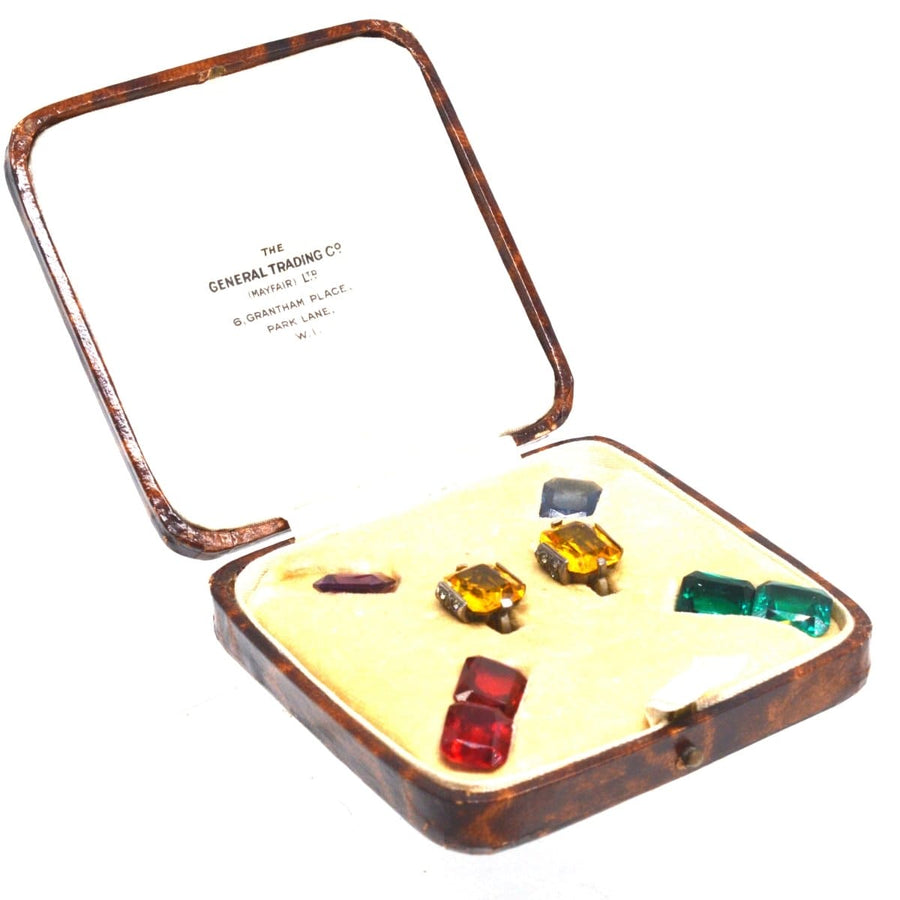 Art Deco interchangeable paste earrings in original case with colorful stones by The General Trading Company.