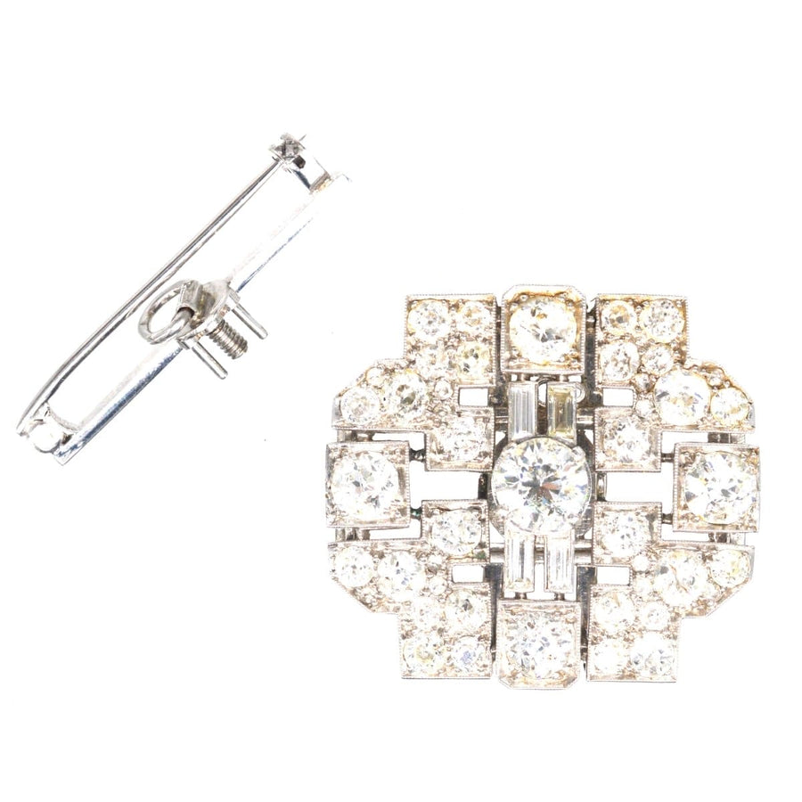 Art Deco platinum diamond brooch featuring 7 carats of diamonds and geometric design, ideal for vintage jewelry lovers.