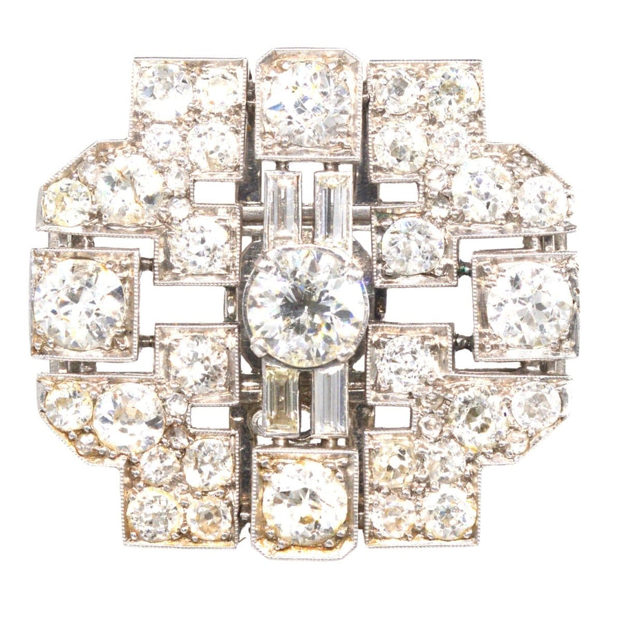 Art Deco platinum brooch featuring 7 carats of brilliant diamonds in a geometric design.