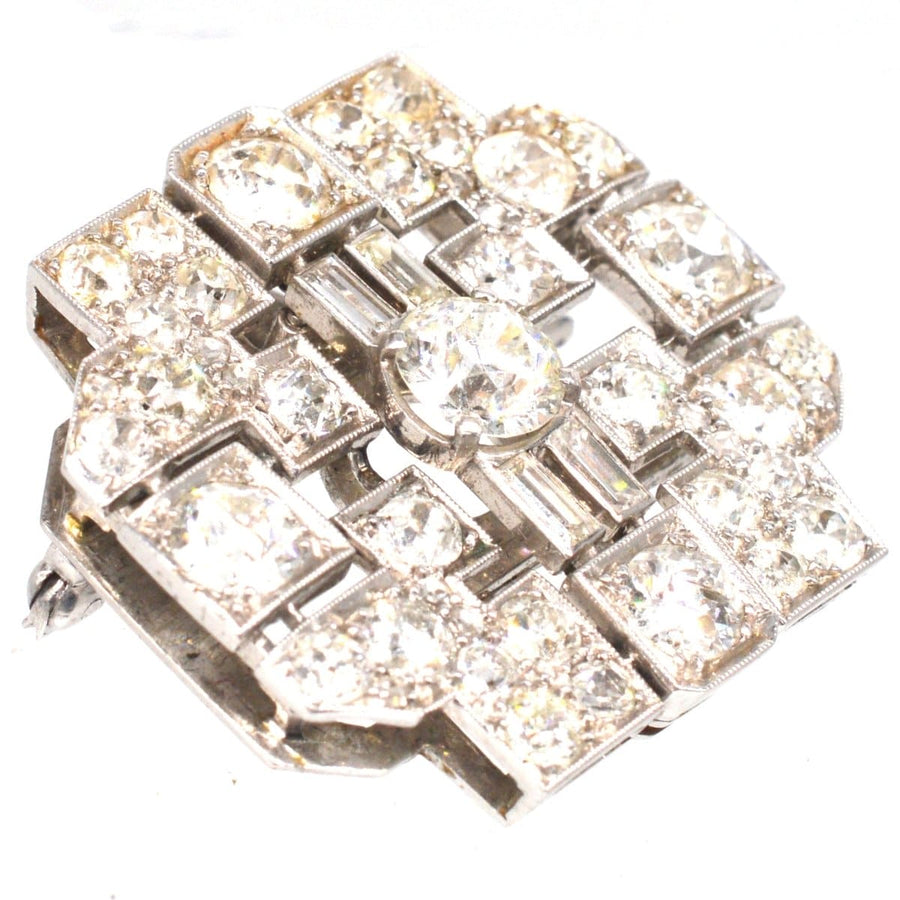 Art Deco platinum brooch with 7 carats of diamonds in a geometric design, perfect for jewelry collectors.