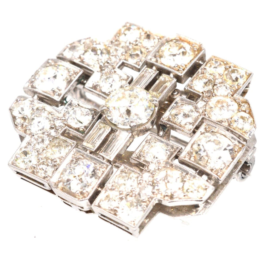 Art Deco platinum brooch featuring 7 carats of diamonds, beautifully geometric design with a shiny finish.
