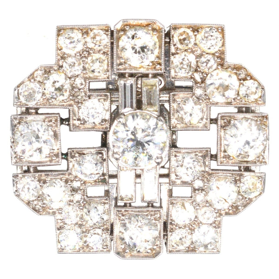 Art Deco platinum brooch featuring a geometric design with 7 carats of diamonds, beautifully crafted.