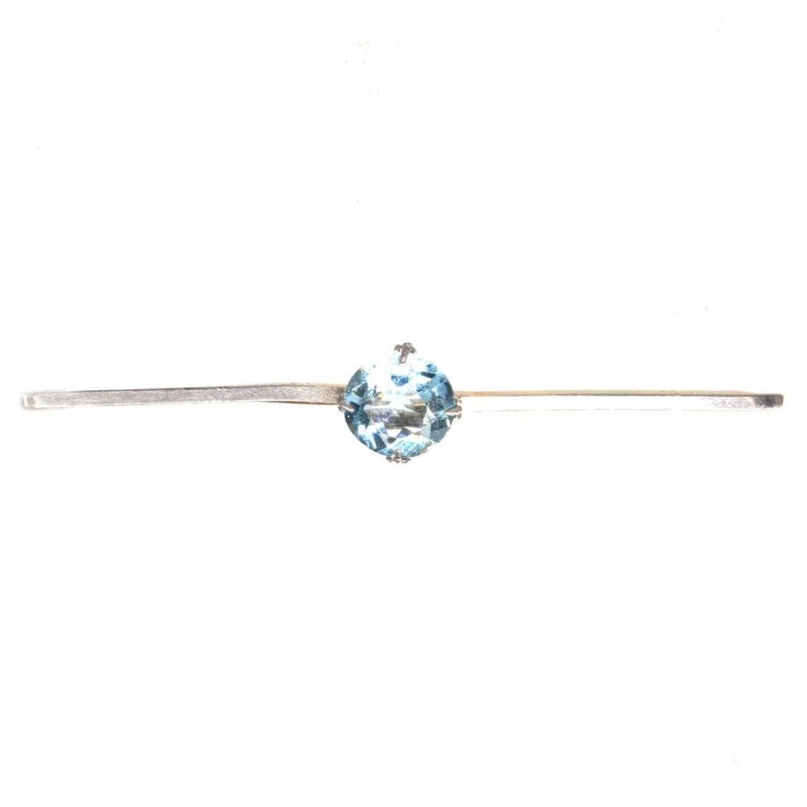 Art Deco platinum and 15ct gold aquamarine bar brooch with unique historical charm.