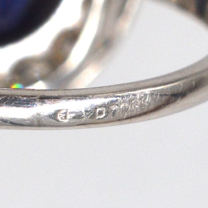Close-up of the engraved inner band of an Art Deco platinum ring showcasing its craftsmanship.