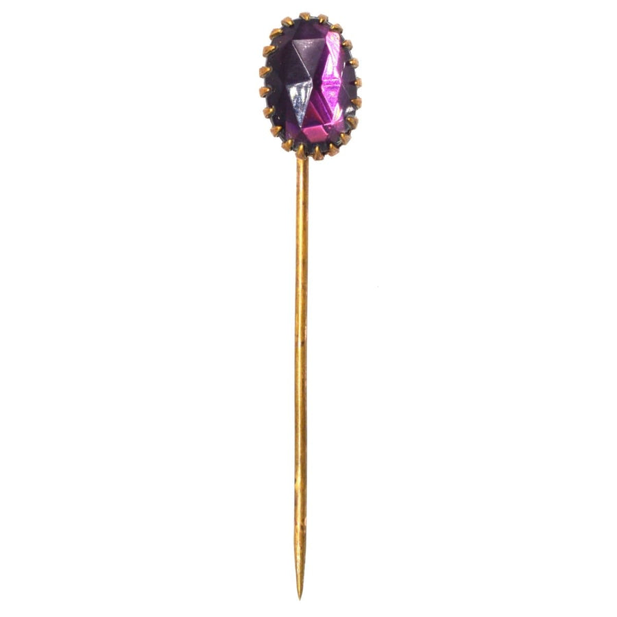Art Deco purple rose cut paste tie pin, featuring a stunning oval purple stone with a gold-tone stickpin design.