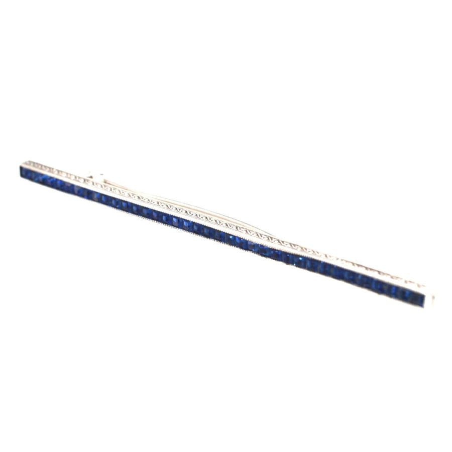 Art Deco silver bar brooch with blue paste stones, featuring deco detailing for a stylish addition to any outfit.