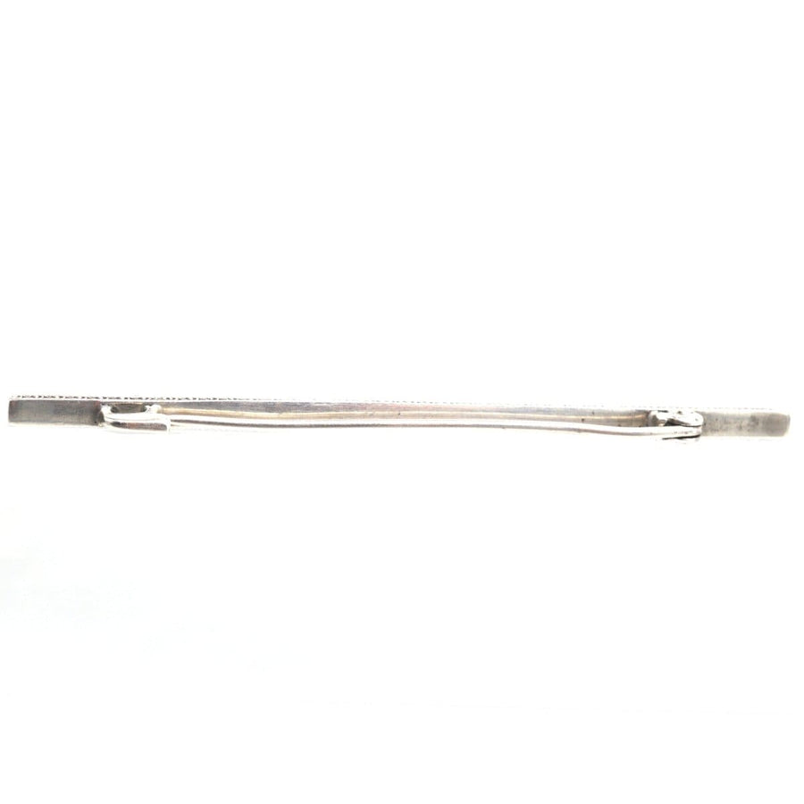 Art Deco silver blue paste bar brooch with elegant detailing, resembling sapphires, perfect for any outfit.