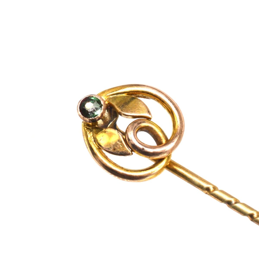 Art Nouveau 9ct green garnet doublet tie pin with leaves, featuring a knot design and antique gold finish.