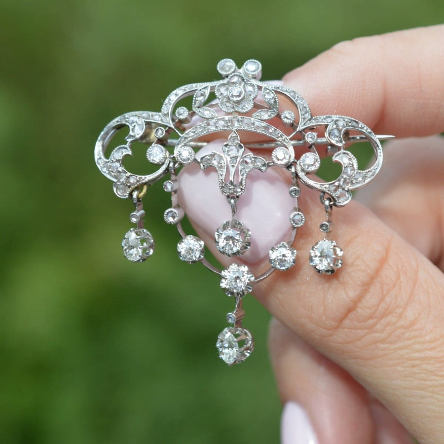 Belle Epoque 18ct white gold diamond drop brooch featuring floral motifs and pear-shaped diamonds.