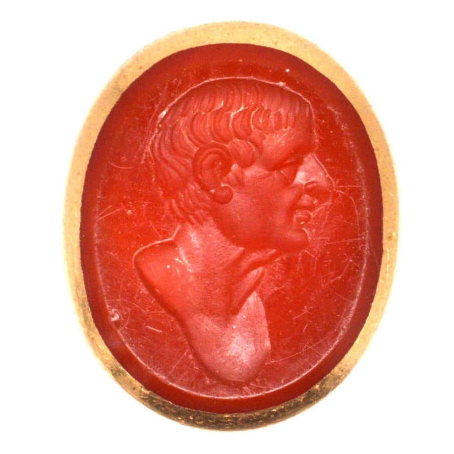 Early 19th century gold seal featuring a carnelian intaglio of a Roman man, possibly an emperor from the 1820s.