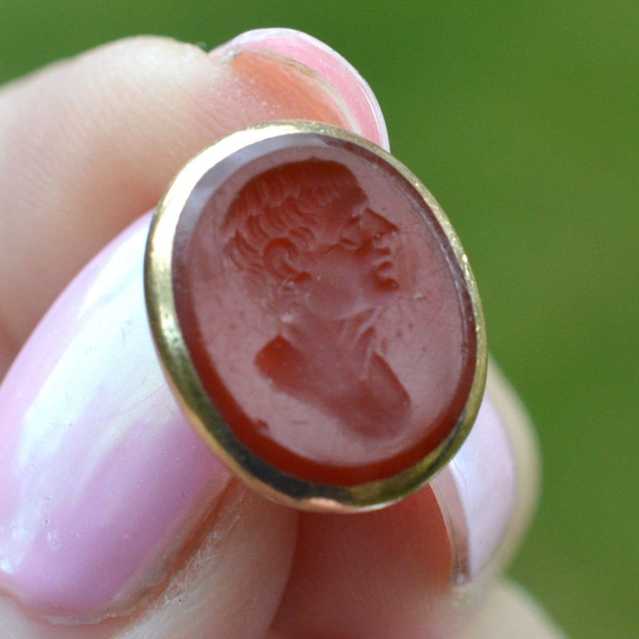 Gold seal featuring carnelian intaglio of a Roman man, dating to the 1820s, a souvenir from Italy.