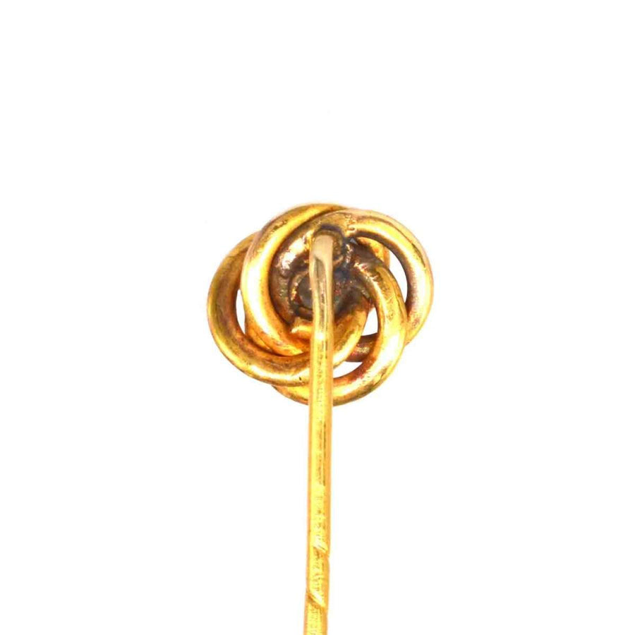 Early 20th century 14ct gold knot tie pin with diamond, symbolizing strength and eternity.