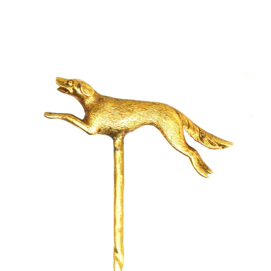 Early 20th century 15ct gold tie pin featuring a running hunting dog, showcasing intricate details of the canine in motion.