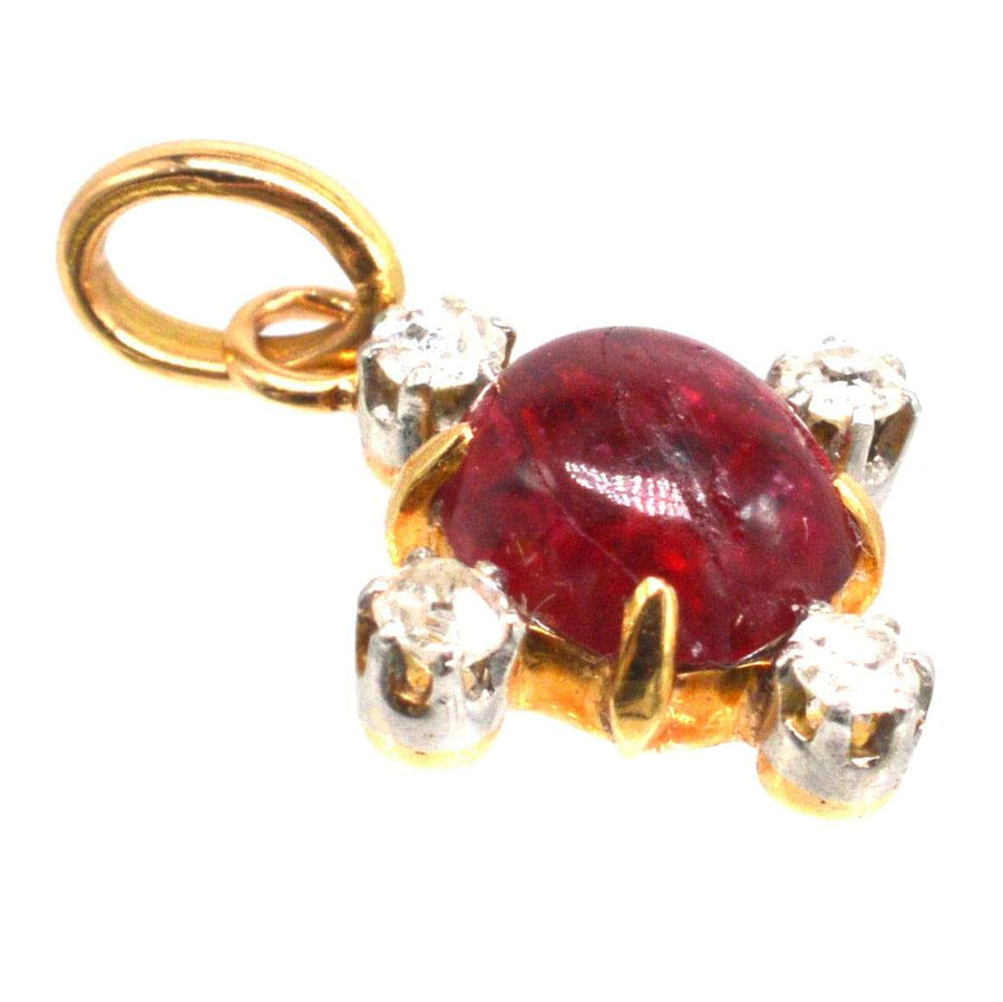 Early 20th century 18ct gold pendant with cabochon ruby and diamonds, vintage elegance and charm.