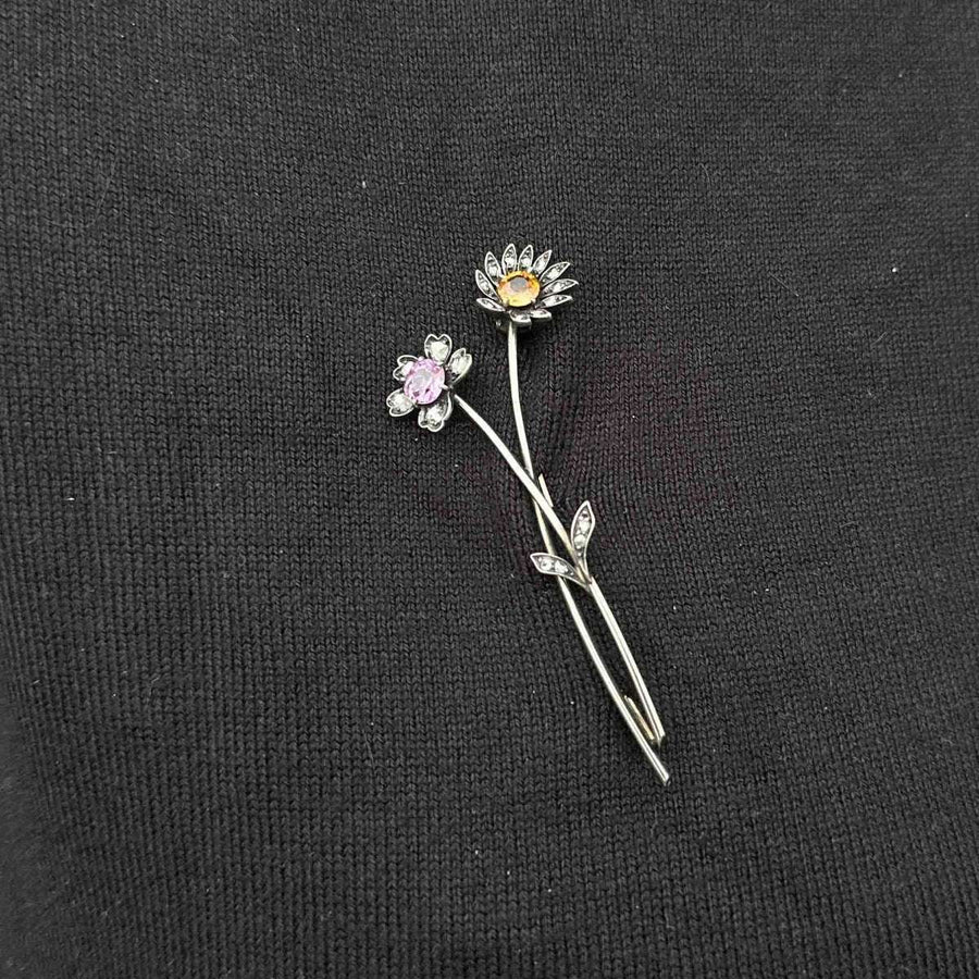 Early 20th Century Austro-Hungarian gold brooch with pink and imperial topaz floral design.