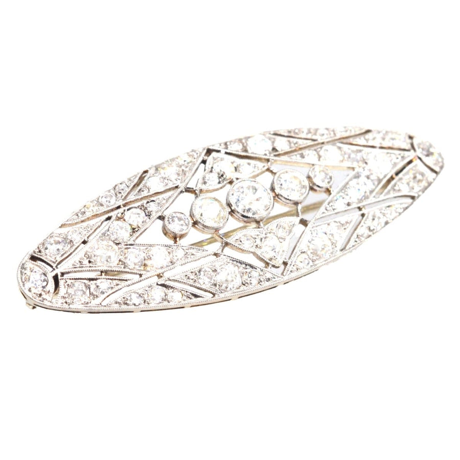Early 20th Century French diamond brooch in platinum and gold, featuring geometric design and 1.6 carats of diamonds.