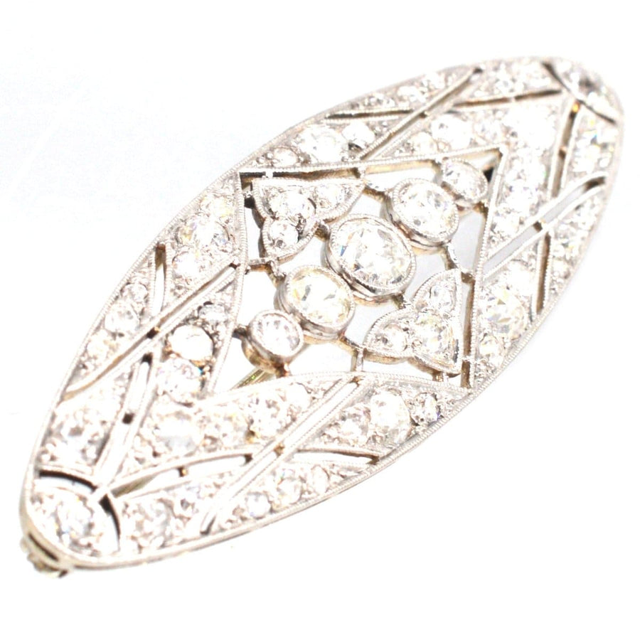 Early 20th century French platinum and gold diamond brooch with geometric design and 1.6 carats of diamonds.