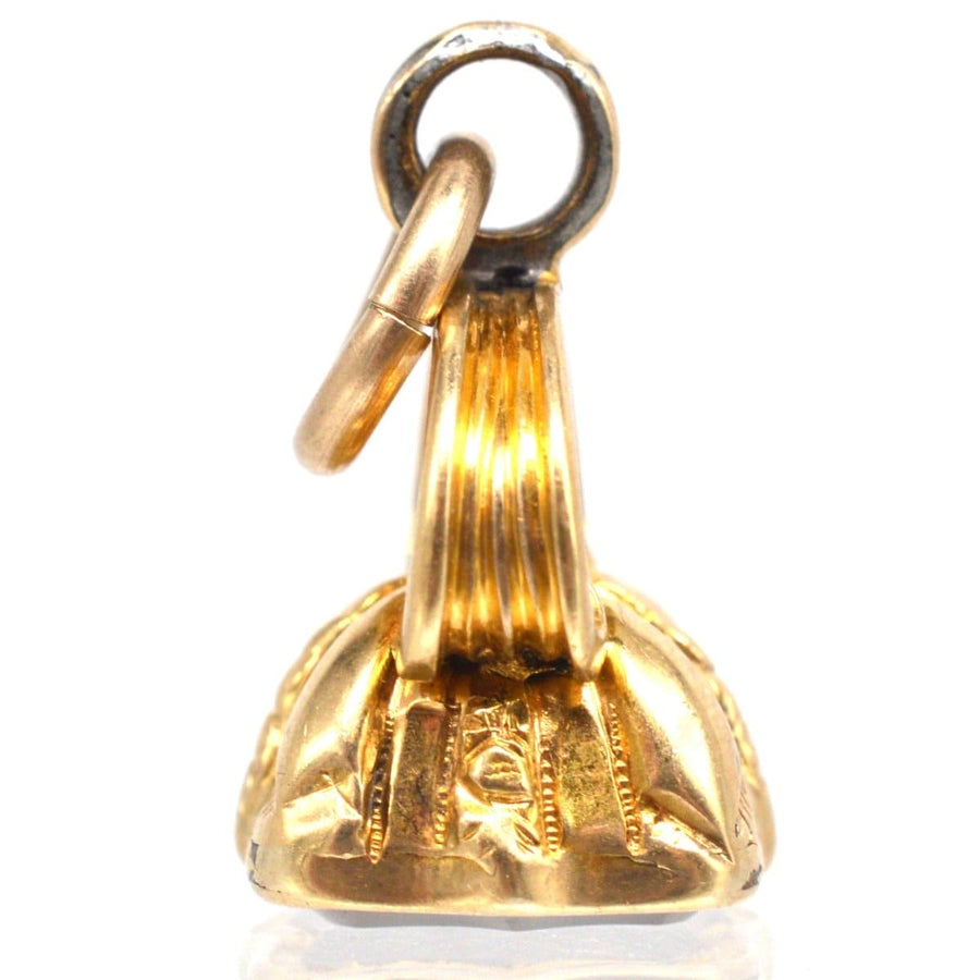 Early Victorian gold seal pendant with intricate detailing and loop for attachment.