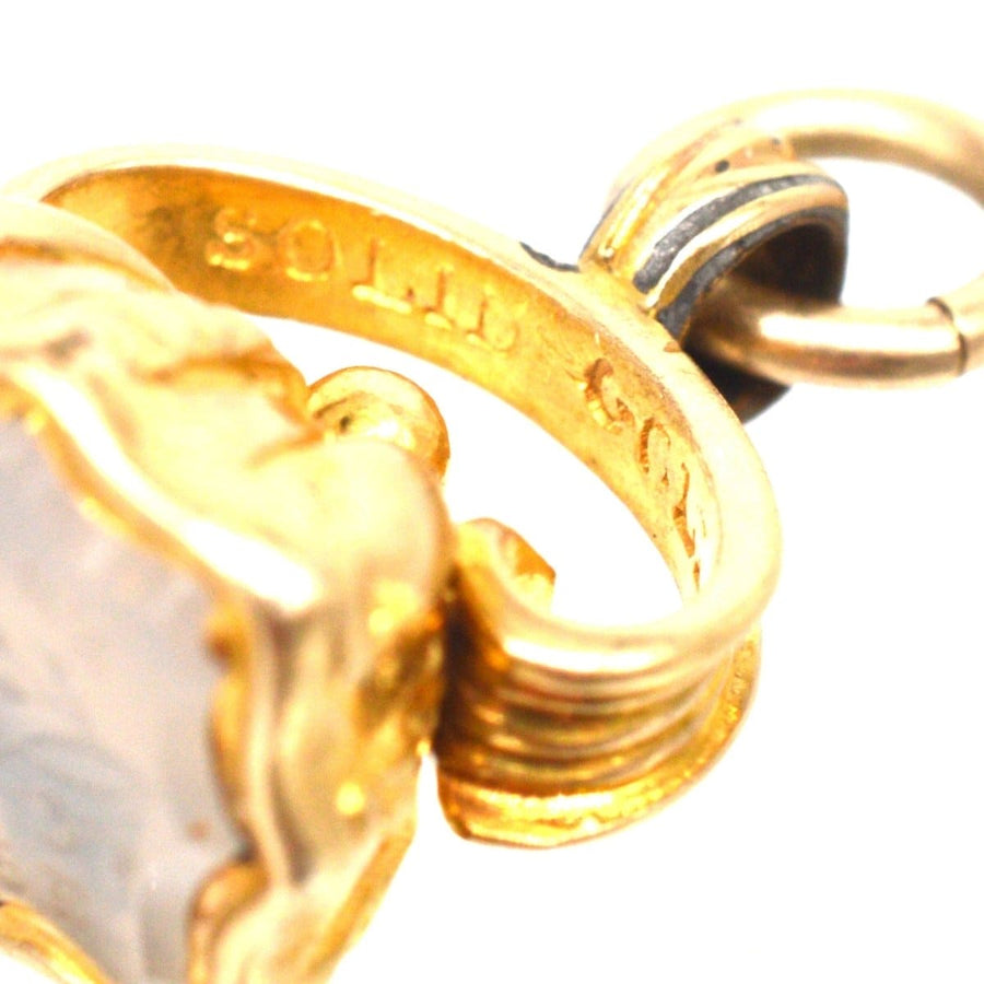 Close-up of Early Victorian gold seal showcasing solid gold hallmark and intricate design.