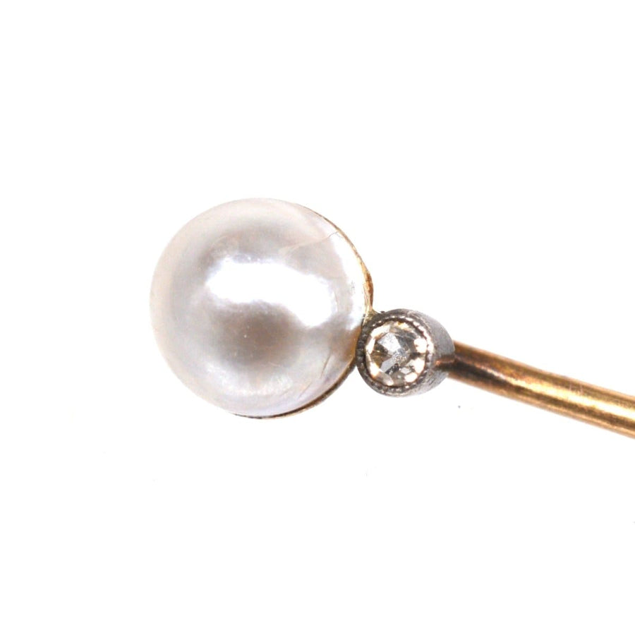 Elegant Edwardian 14ct gold tie pin featuring a natural pearl and diamond accent, perfect for stylish silk ties.