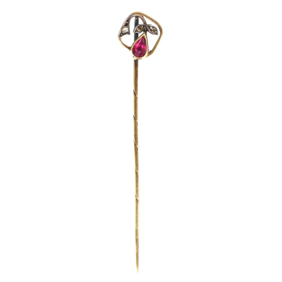 14ct gold Edwardian tie pin featuring synthetic red spinel and diamond leaf accents, made in Austria.
