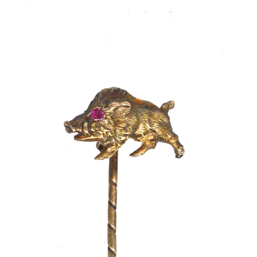 14ct gold wild boar tie pin with ruby eyes, symbolizing bravery and strength in a beautifully crafted design.
