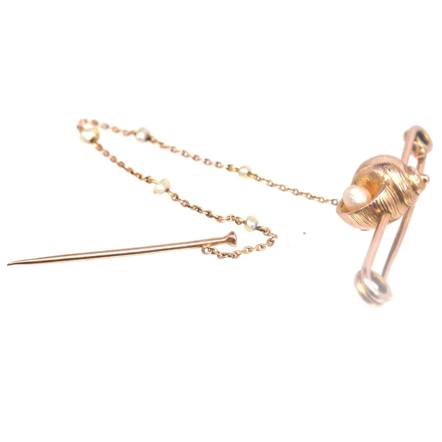 Edwardian 15ct gold bar brooch featuring a seashell and pearl, with a beautiful pearl chain and pin.
