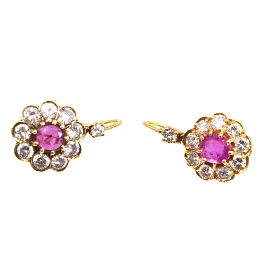 Edwardian 15ct gold earrings featuring diamond and ruby clusters, showcasing classic early 20th century jewelry elegance.