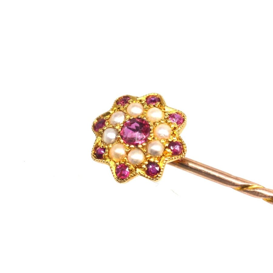 Edwardian gold tie pin with garnets and seed pearls, flower design, perfect for ties and special occasions.