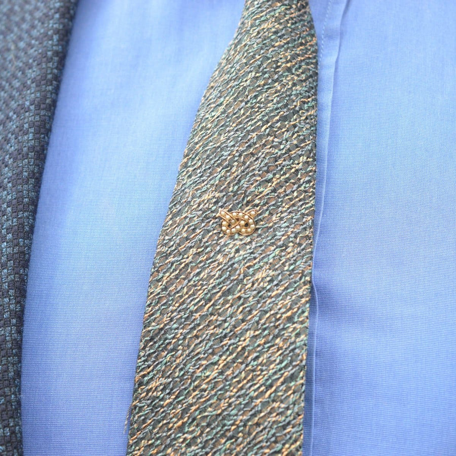 15ct gold Stafford knot tie pin displayed on a patterned tie, showcasing vintage elegance and craftsmanship.