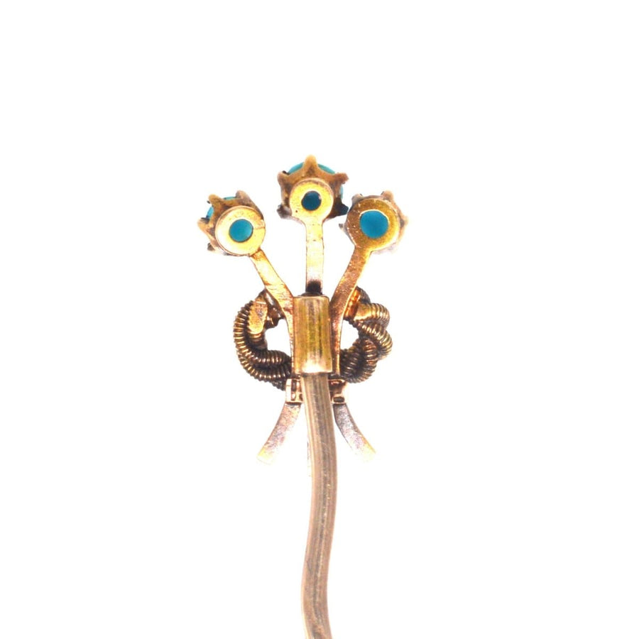 Edwardian 15ct gold tie pin featuring trio of turquoise stones in a floral design, symbolizing protection and good luck.