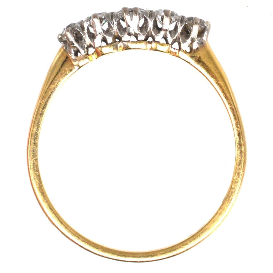 Edwardian 18ct gold and platinum five stone diamond ring, perfect as an engagement ring, showcasing elegant design.
