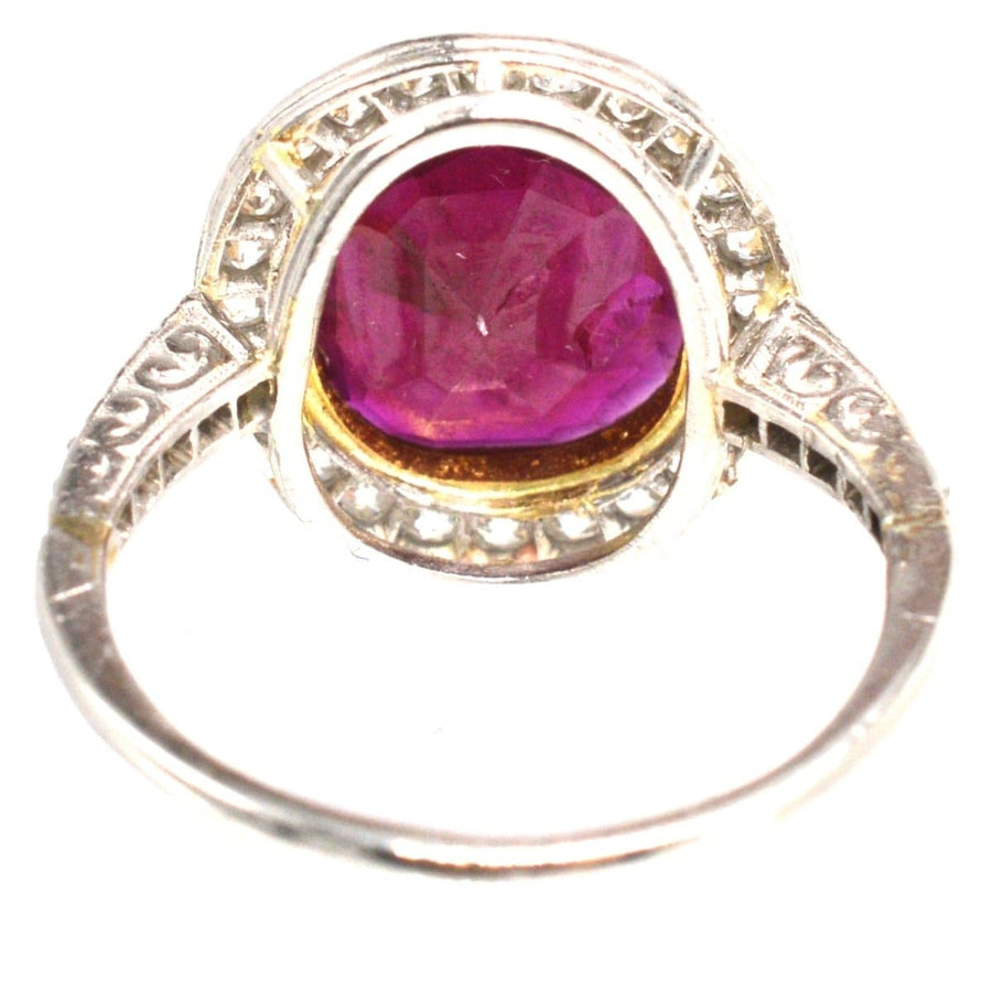 Edwardian 18ct white gold ring featuring a large unheated Burma ruby and diamond cluster.