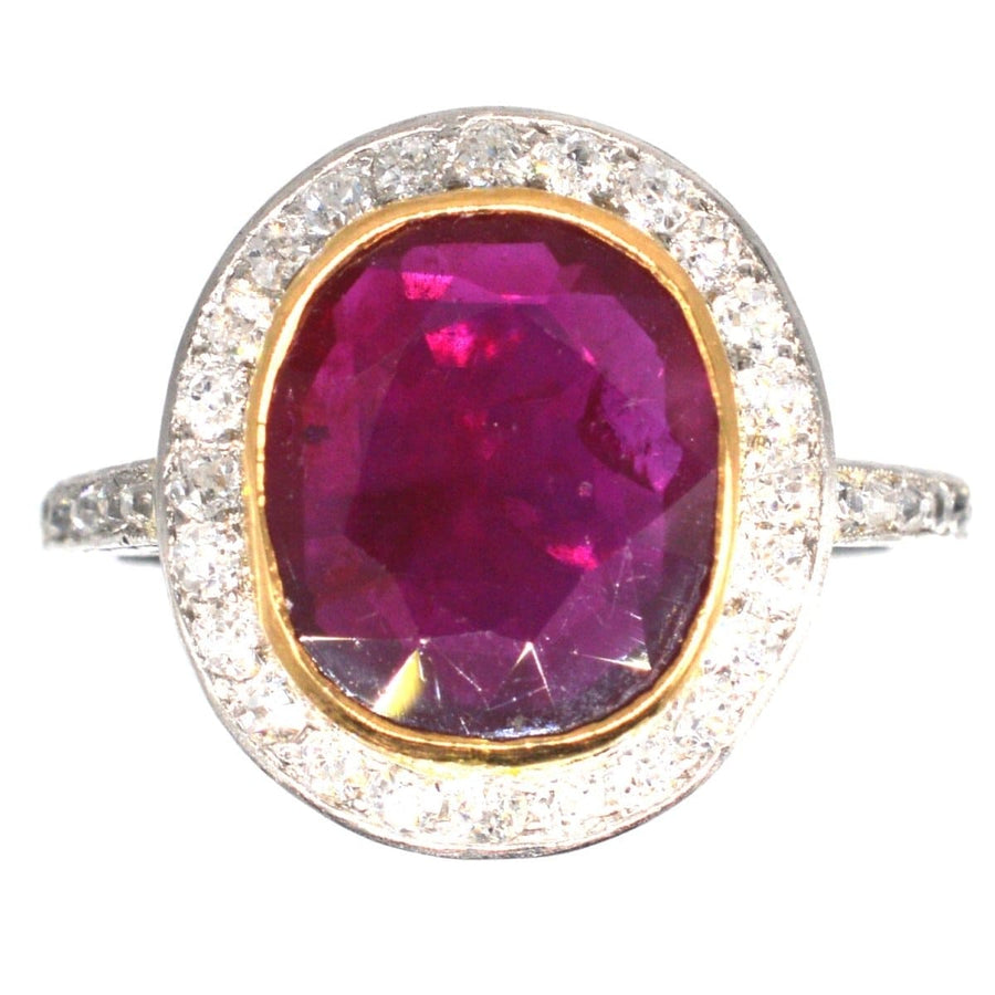Edwardian 18ct white gold ring featuring a large unheated Burma ruby and diamond cluster surrounding.