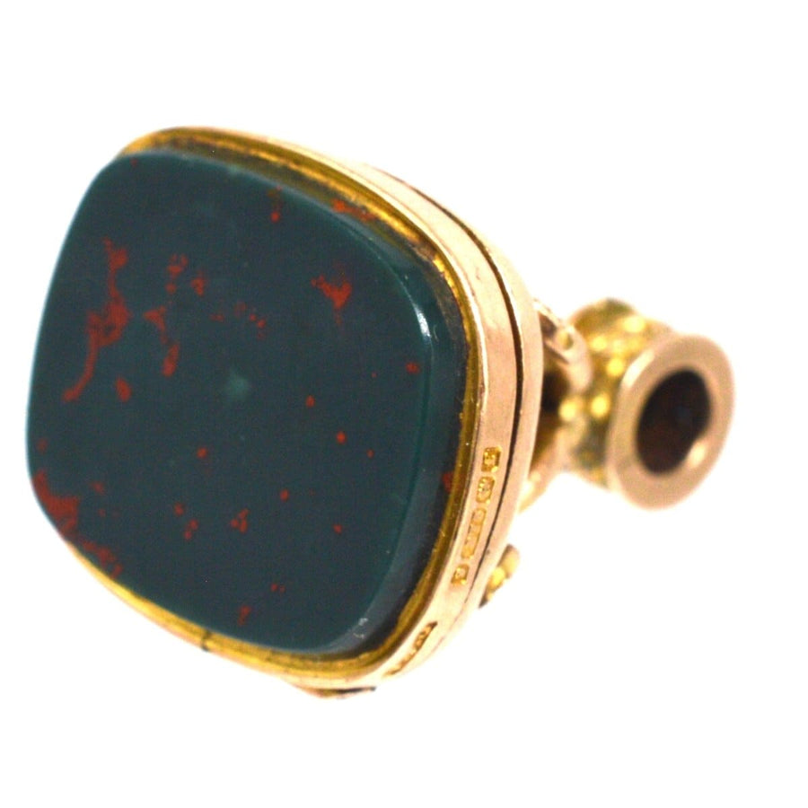 Edwardian 9ct gold locket pendant with bloodstone, featuring embossed swirl knot design for photos.