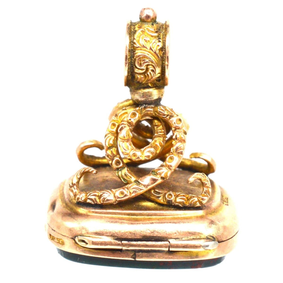 Edwardian 9ct gold opening locket seal pendant with bloodstone and embossed swirl knot design.