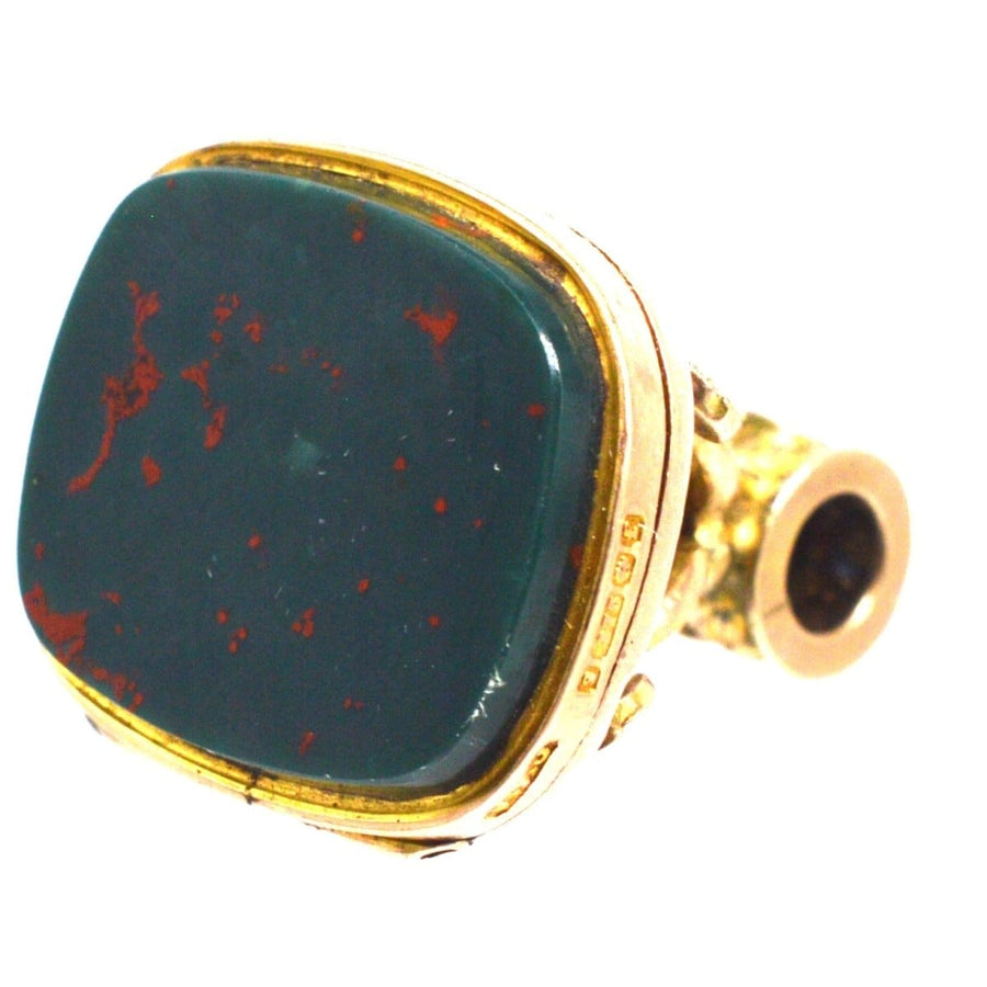 Elegant 9ct gold ring featuring a square bloodstone with unique red speckles, perfect for vintage jewelry lovers.