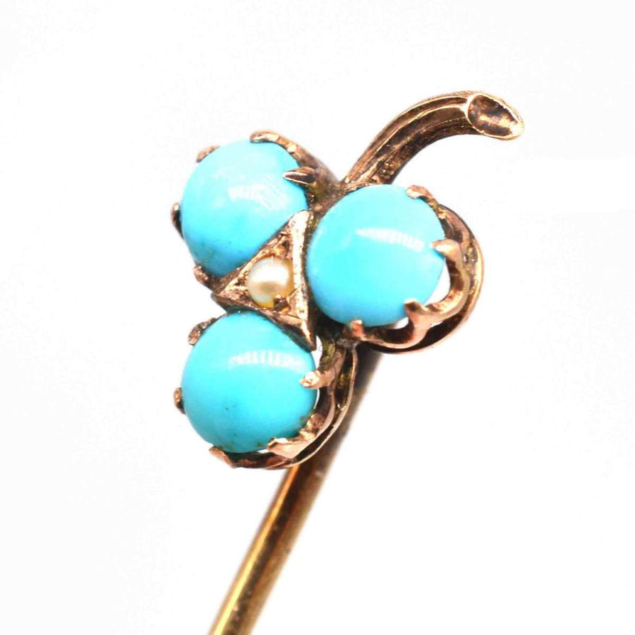 Edwardian 9ct gold shamrock tie pin set with turquoise beads and a pearl, symbolizing good fortune.